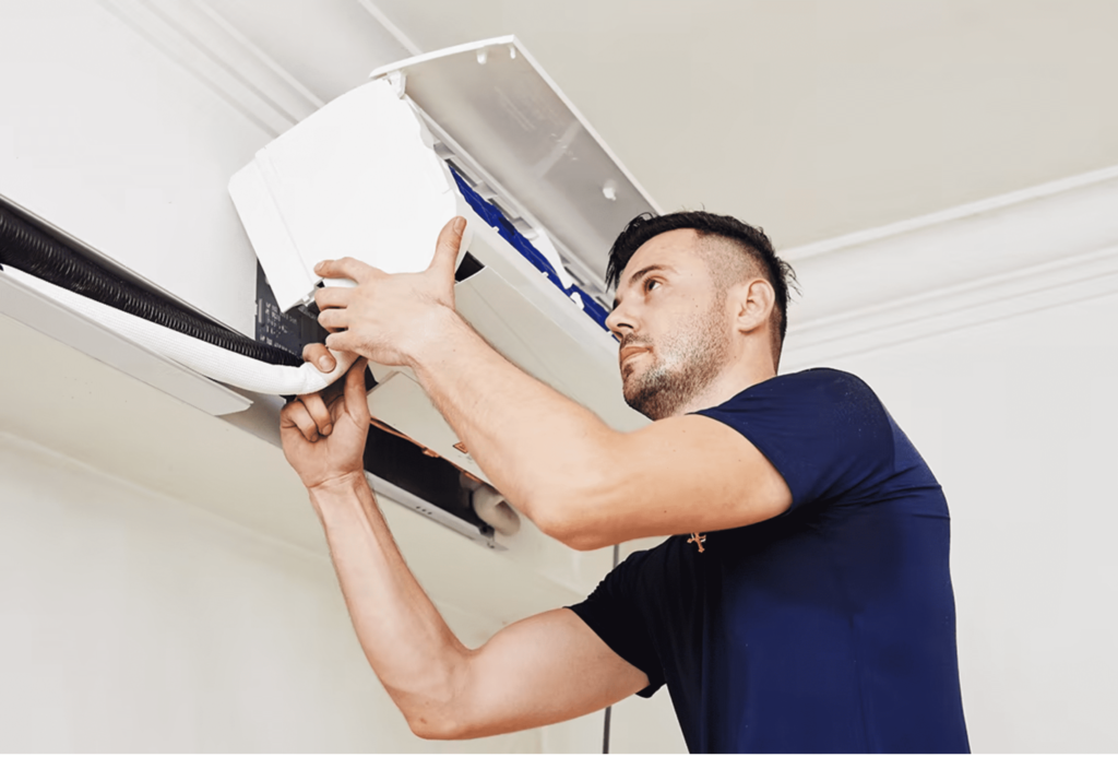 Hermes doing general servicing of aircon himself