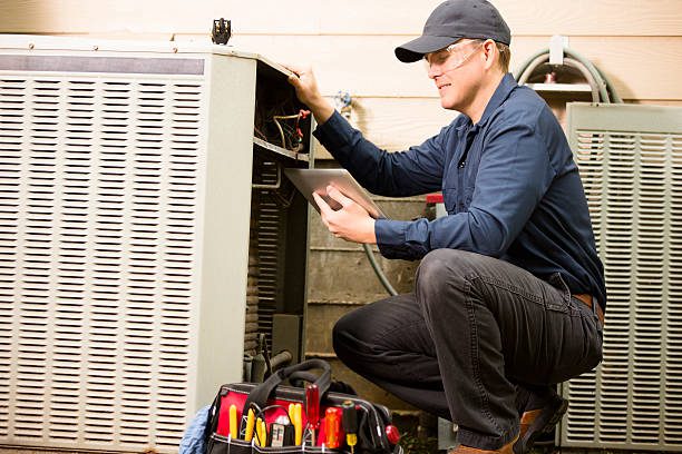 https://www.istockphoto.com/photo/air-conditioner-repairman-works-on-home-unit-blue-collar-worker-gm489211146-74593865?utm_source=pexels&utm_medium=affiliate&utm_campaign=sponsored_photo&utm_content=srp_inline_media&utm_term=air%20conditioner%20technician