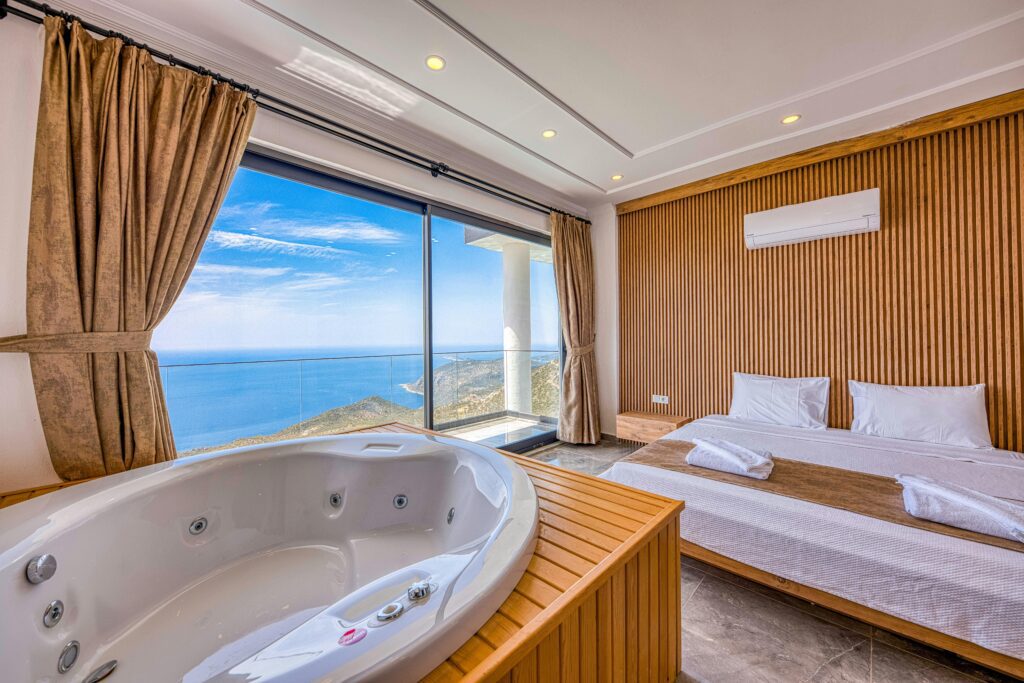 Photo by Ahmet ÇÖTÜR from Pexels: https://www.pexels.com/photo/luxury-hotel-room-with-ocean-view-and-jacuzzi-31817153/