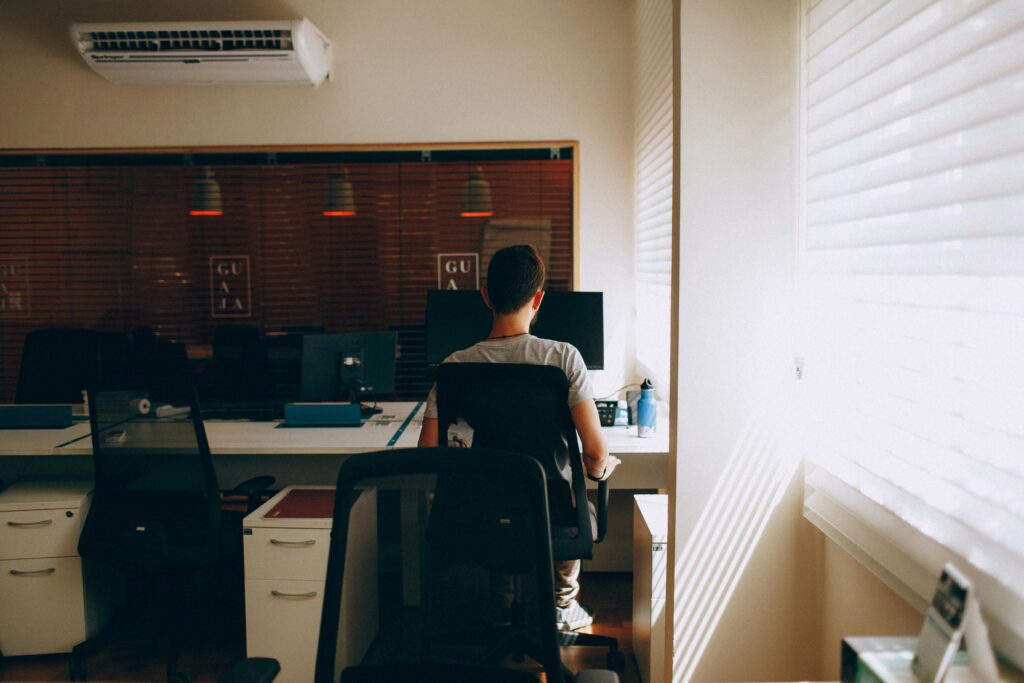 https://www.pexels.com/photo/person-in-gray-shirt-sitting-on-computer-chair-3215593/