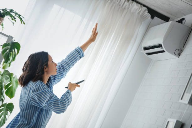 https://www.istockphoto.com/photo/turning-on-the-air-conditioner-gm1259269839-369055374?utm_source=pexels&utm_medium=affiliate&utm_campaign=sponsored_photo&utm_content=srp_inline_media&utm_term=AIRCON%20COOLING%20THE%20ROOM